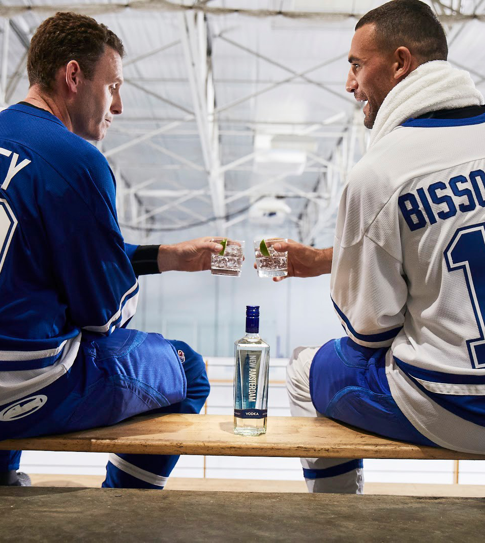 Enemy hockey players toasting over NAM Vodka